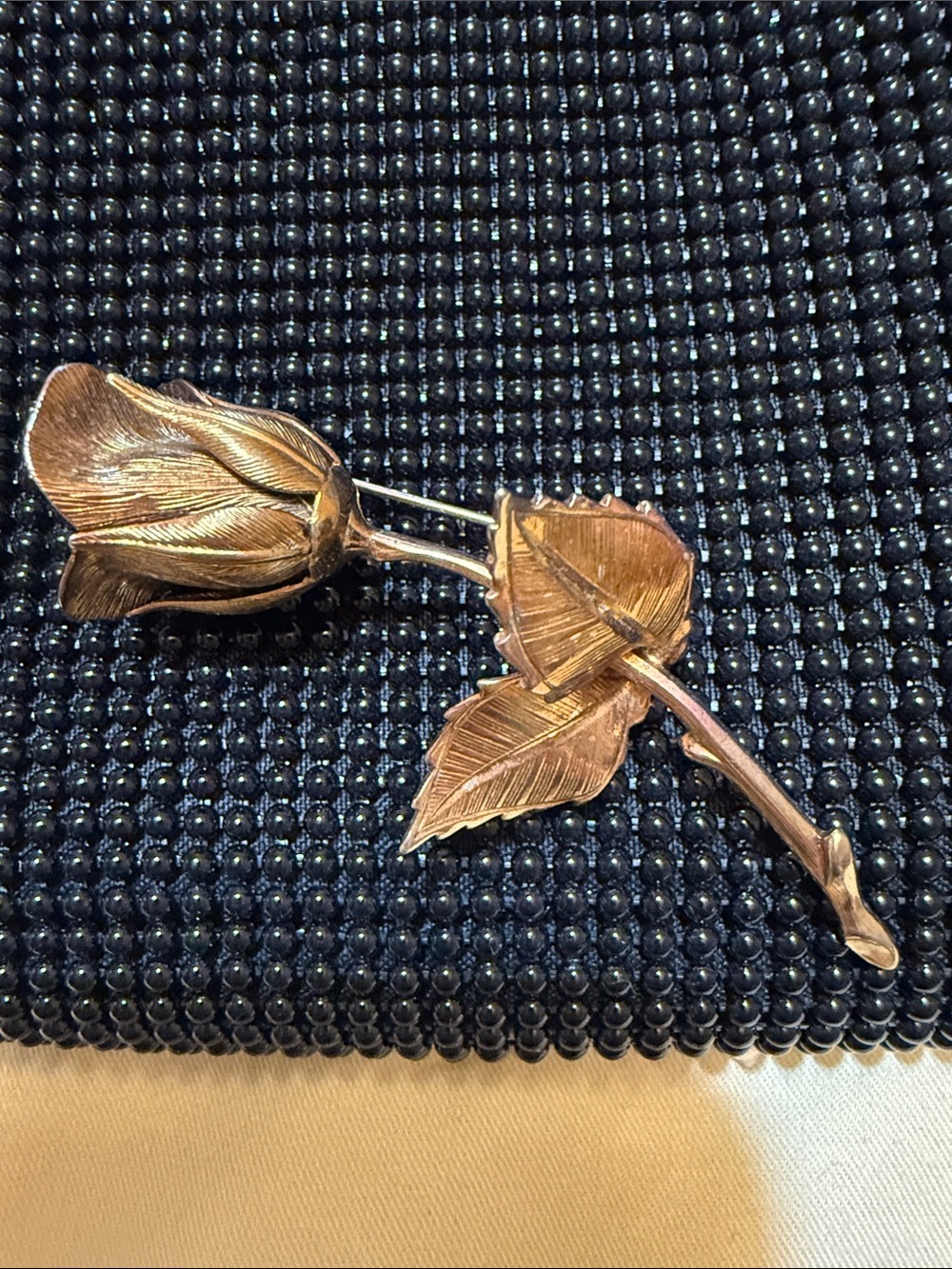 70s Giovanni inspired Rose w/ stem & leaves in this rose and gold toned brooch.